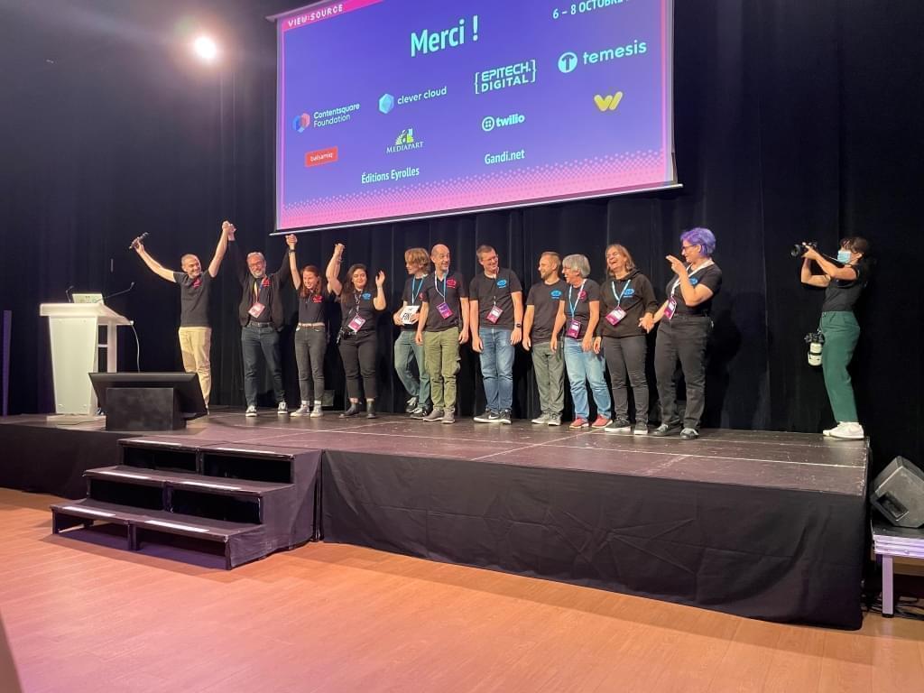 Paris Web staff greeting the audience from the stage